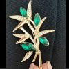 green stones brooch