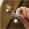 Silver brooch bow pearl