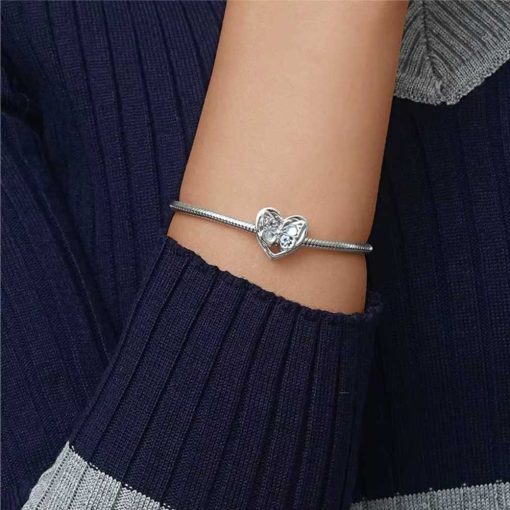 silver heart-shaped ring pendant