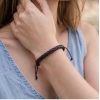 brown leather bracelet.
